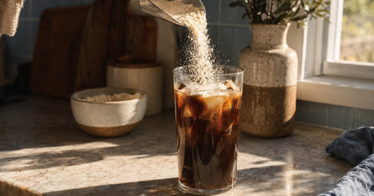 Three glasses of iced coffee graduating from dark to pale, showing increasing protein amounts